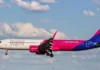 Wizz Air ქუთაისი: როგორ ვიმოგზაუროთ ევროპაში მინიმალური დანახარჯით Wizz Air Plane at Kutaisi International Airport Tarmac